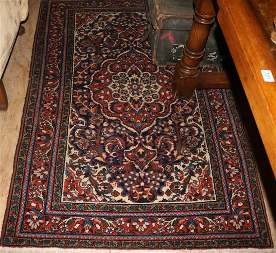 Red, blue & cream patterned rug(-)